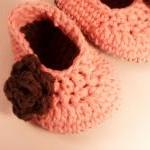 Peach baby booties with bro..